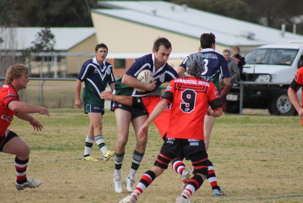 RUN HARD: Stanthorpe Gremlins' Jason John puts the pressure on his Inglewood Roosters' defenders. RUN HARD: Stanthorpe Gremlins' Jason John puts the pressure on his Inglewood Roosters' defenders.